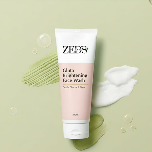 ZEDS Gluta Brightening Face Wash tube on a green background with soap bubbles and a swatch of soap.